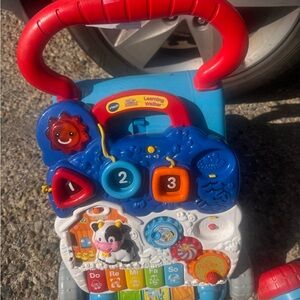 Sit-to-Stand Learning Walker - Red, Blue, and White